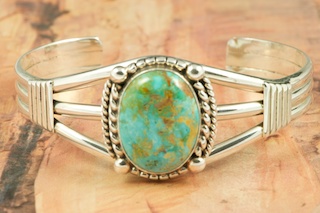 Genuine Crow Springs Turquoise set in Sterling Silver Bracelet. The Crow Springs Mine is located near Tonopah, Nevada. Created by Navajo Artist Milton Lee. Signed.